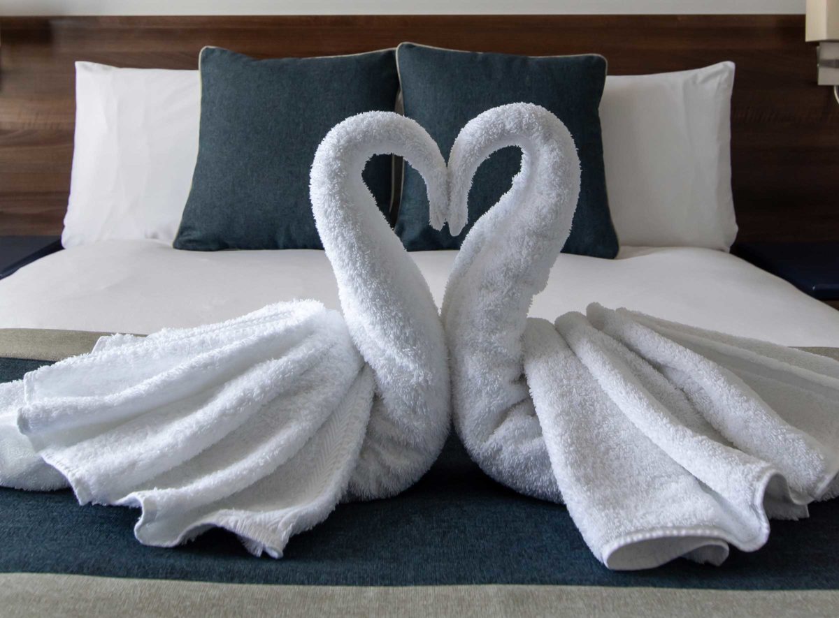 New Steine Hotel Deluxe Double Bedroom with towel swans!